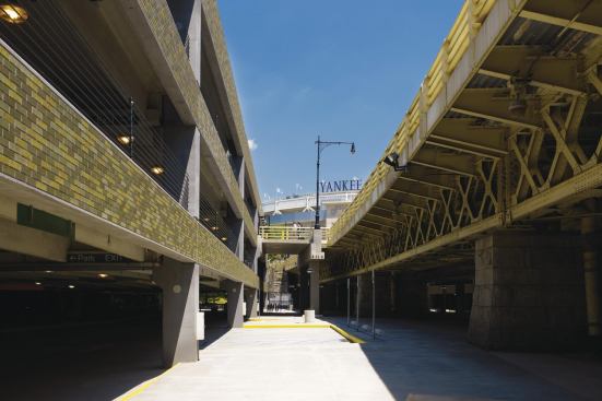 The brick veneer on the precast spandrels are finished in four hues of green to help the structure complement the natural environment.