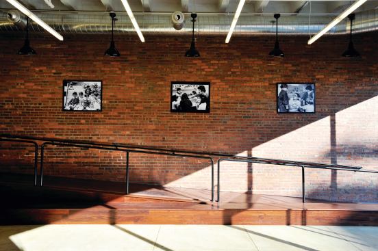 The new SED center, housed in a converted shoe warehouse from the 1940s, offers a light, bright space for kids to learn and play yet retains some industrial touches (such as an exposed brick wall on the ground floor).