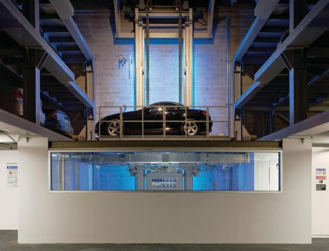 For the 40-space, automated vehicle storage system at One York, a residential building in New York by Ten Arquitectos, Park Plus installed a palletless comb exchange that can convey a car from its parking space to its driver within a minute.