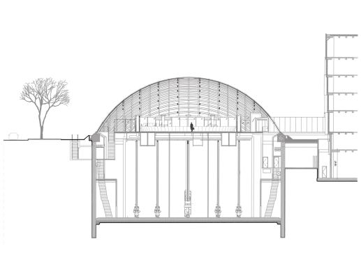A secction through the building shows the reading room above grade and the Automated Storage and Retrival System (ASRS) in the subterranean stacks.
