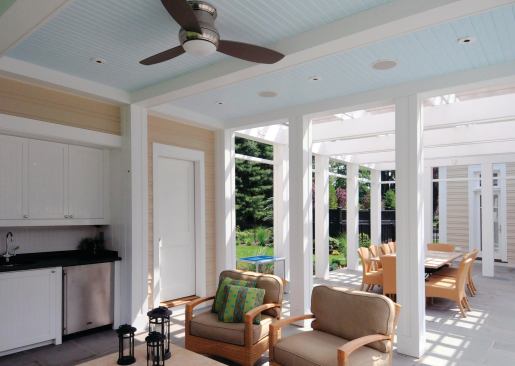 The full-coverage roof shelters a small kitchen and a bath/changing room.