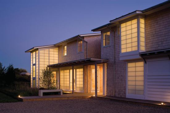At night, the north side of the house emits a soft glow through thermal Kalwall panels.