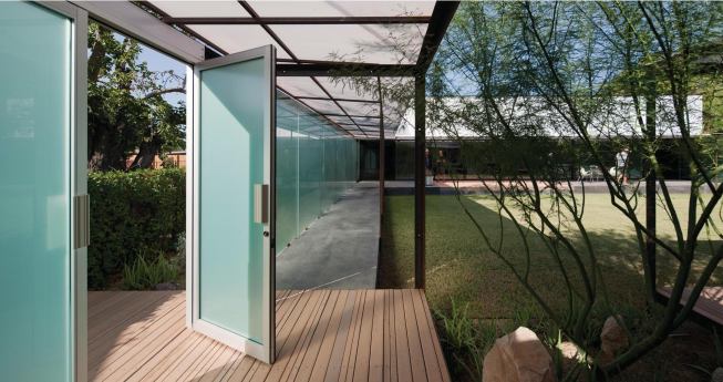 The garden wall opens onto the hidden courtyard.

