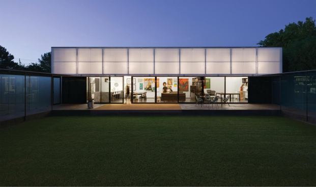 When lifted, the live/work pavilion's operable polycarbonate awning becomes a giant lantern.