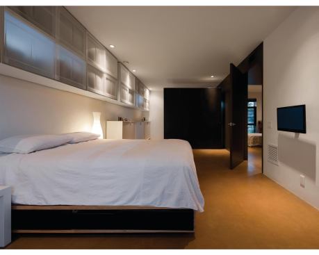 The master bedroom. Apart from the garage, the original ranch house now is devoted exclusively to private spaces.


