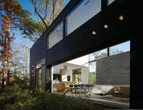 A 20-foot-wide glass wall opens to the outdoors.