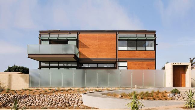 2011 Grand Award- Custom Home 3,000 to 5,000 square feet

Macy Architecture / Jensen & Macy Architects, San Francisco



Plenty of decks and overhangs protect the Sustainable Steel Home from the hot San Diego sun. The house maximizes its infill location by providing city and water views to the main rooms, which all occupy the second floor. Photovoltaics produce on-site power, and rainwater harvesting meets the site's irrigation needs. Lots of glass, both transparent and translucent, helps with daylighting and passive solar.