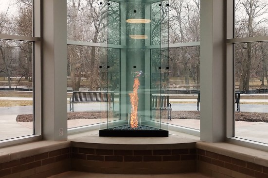 Montigo’s 176-inch-tall Tornado fireplace at the Beacon Health & Fitness building in Elkhart, Ind., highlights a spinning cylindrical fire feature.