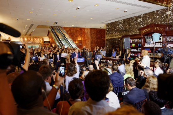 The President at a campaign event at Trump Tower in 2015, when the Trump Store still occupied the space reserved for a public bench