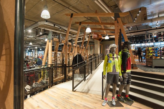 The store’s 50,000 products can overwhelm visitors so REI and CallisonRTKL broke up the floor with terraces and a mezzanine level. REI's Jared Pearce says the different platforms create “a sense of an amphitheater,” harking back to the concerts and sporting events held in the arena.
