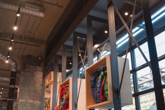 To showcase merchandise in window frontage, REI created a steel fin-wall system with a slim profile.