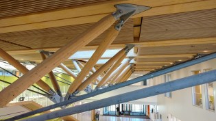Detail of the zipper trusses, which utilize compression and tension members to transfer gravity loads to the timber structural system.