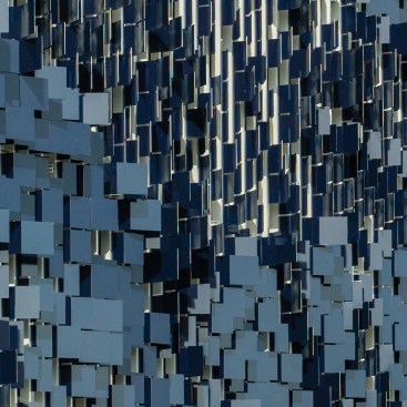 The west faces of the aluminum flaps are painted in royal blue.