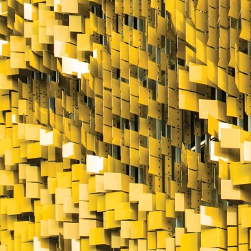 The east faces of the aluminum flaps are painted in bright yellow.