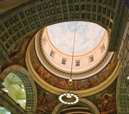 The completely restored 3,000 pound chandelier features induction lamp sources, which provide soft light for the historic glass shades, while concealed 70W ceramic discharge metal halide PAR lamps project light into the dome’s apex fresco. Lenses near the glass shades’ rims “siphon” light from the historic bowls’ uplight distribution and redirect to murals at the drum’s base.
