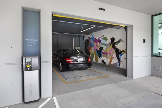 In an automated parking system users drop their car in a large bay room and leave, keeping their keys.