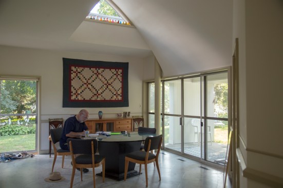 Lockard sitting in the house's dining area