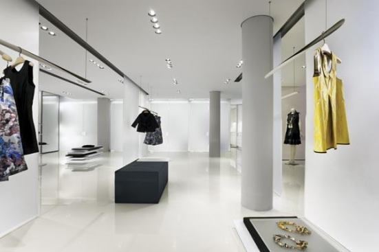 The fitting rooms at the rear of the store, are conceived as translucent floating volumes.