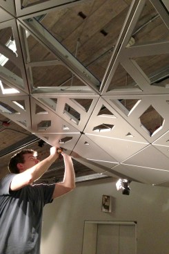 Installing the 1/3-scale mock-up of the ceiling reflector at LMN Architects' office