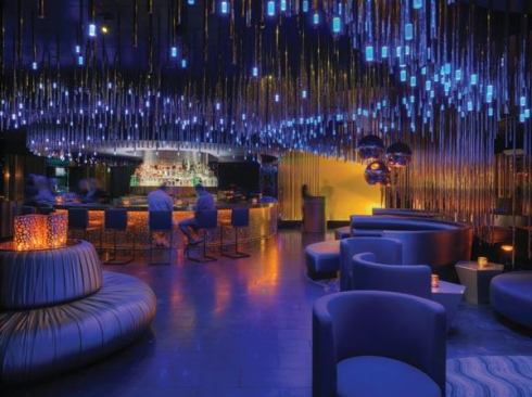 The hotel’s Whiskey Blue bar. Brass tubes suspended from the ceiling and outfitted with blue LEDs create a dramatic effect.