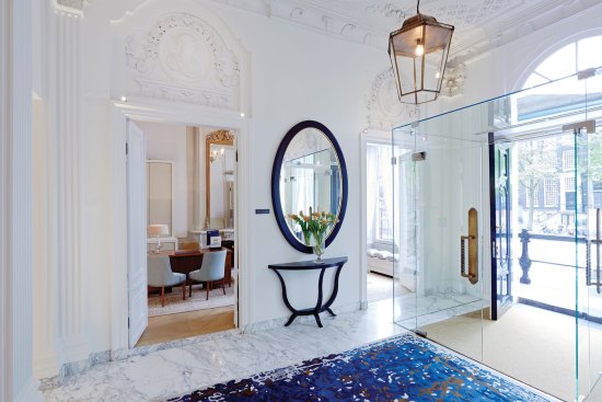 The hotel's main entry features historic architectural details complemented by contemporary finishes.