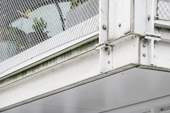 Deterioration of the white cladding of the Waterwoningen project in Amsterdam.