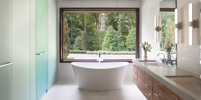 Oversized windows offer more visibility to the outdoors and can help dramatically reduce some health issues. Having a stronger connection with the outdoors can improve mood as well as provide a dramatic backdrop (Weather Shield Direct Set Windows is shown).