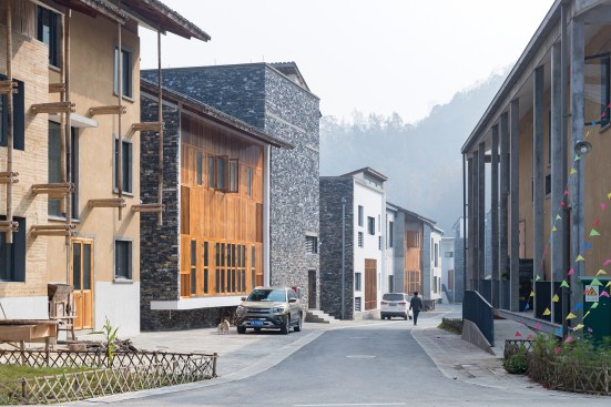 A street in the new neighborhood, lined with the two- to four-story multifamily buildings