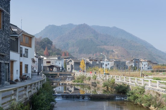 View of Wencun showing some rebuilt residences (left) and the new neighborhood beyond (at right)