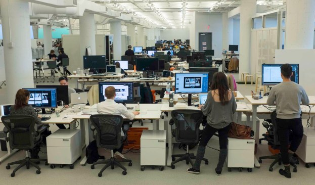 R/GA employees at their adjustable, standing desks installed into the new Hudson Yards office space.
