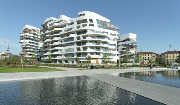 The residential complex designed by Zaha Hadid Architects is more curvaceous in form than Libeskind’s, with wood inlays set around the concrete structure.