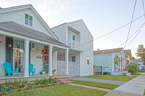 The firm built a new single-family residence on a site occupied by an existing house to accommodate three generations of a family. Fit together like puzzle pieces, the two buildings share outdoor space but allow for private circulation.