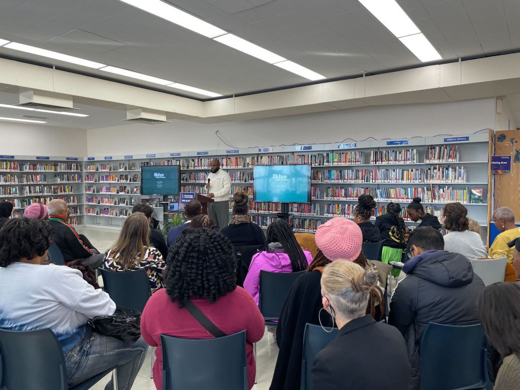 MASS designer DaMario Walker-Brown presents the New Lots Library designs to the Brooklyn community on Dec. 7, 2024.